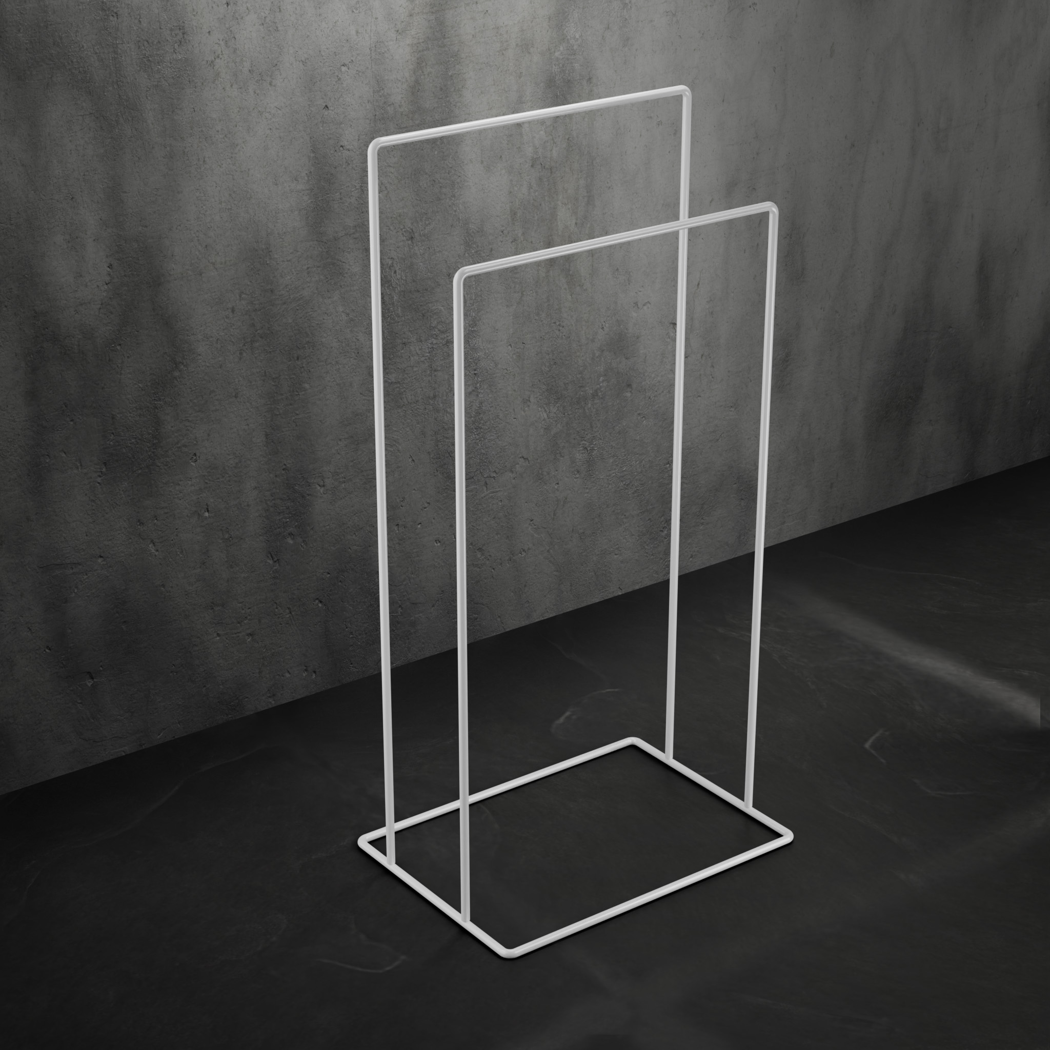 biały, minimalistyczny stojak łazienkowy na ręczniki AVRO ustawiony na ciemnej, betonowej podłodze przy ścianie z surowego betonu.